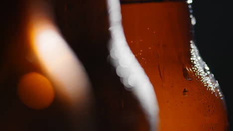 Close-Up-Of-Condensation-Droplets-Running-Down-Bottles-Of-Cold-Beer-Or-Soft-Drinks